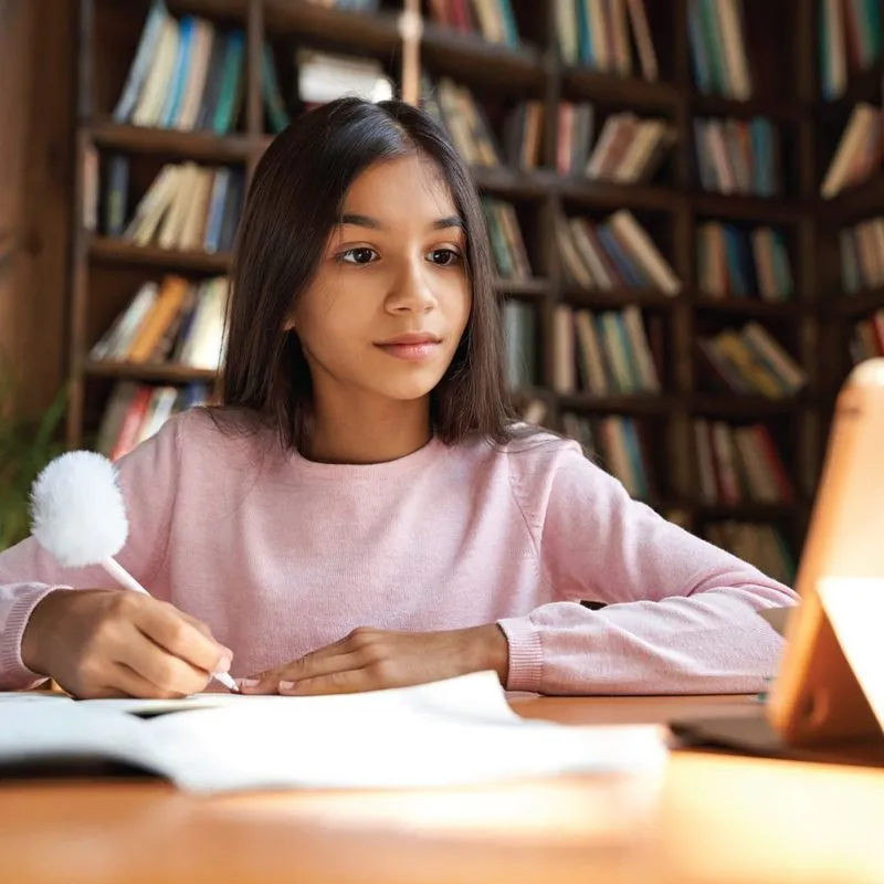 A student learning from home with a laptop, the kind of support Fullmind homebound services provide.